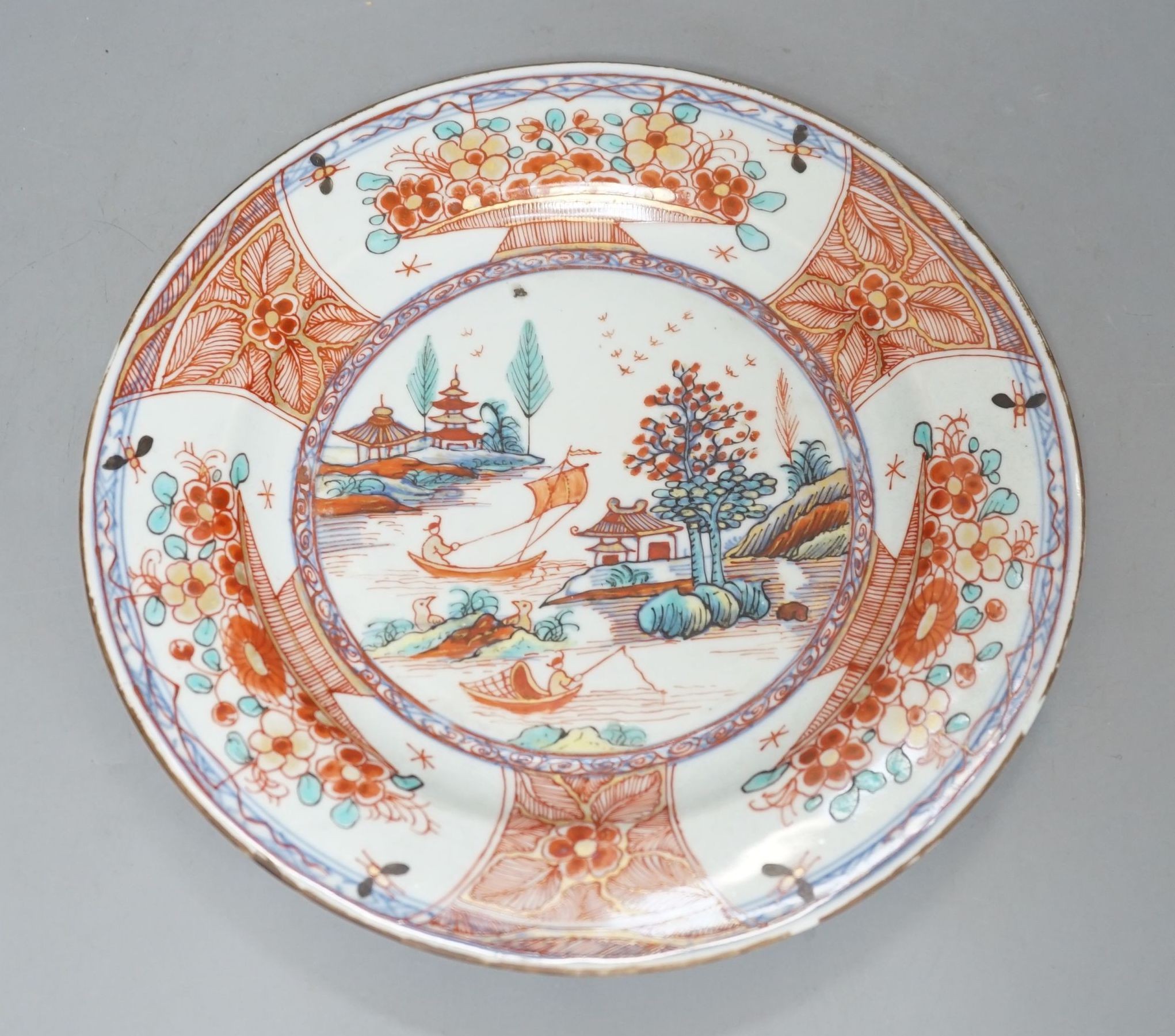 An 18th century Chinese clobbered plate, 23 cms diameter.
